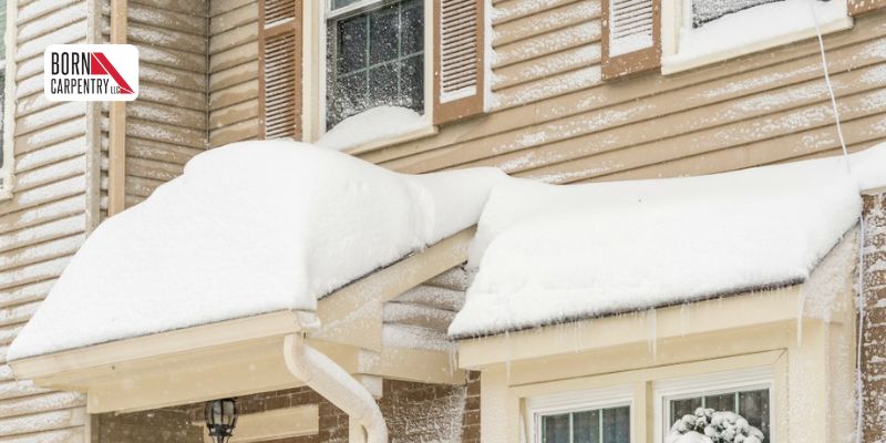 Cracked vinyl siding caused by cold temperatures and winter impact damage